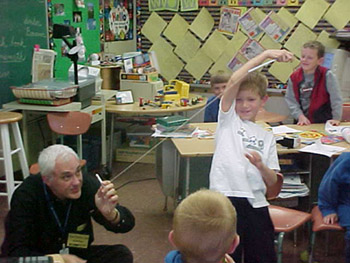 Joe doing demonstration in class of young students.