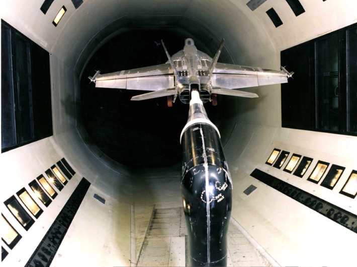 Photograph of an F-18 model mounted in the NASA Ames wind tunnel.