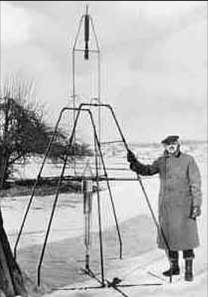 Photo of Robert Goddard with the first liquid propellant rocket