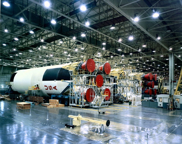 Photo of row of Saturn V first stages in the factory.
