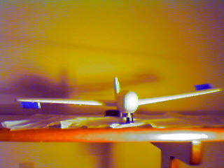 The right aileron is down and the left aileron is up