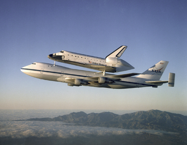 Photo of Shuttle being carried by a Boeing 747.