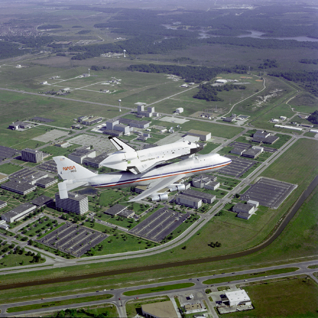 Photo of Shuttle being carried by a Boeing 747.